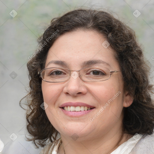 Joyful white adult female with medium  brown hair and blue eyes