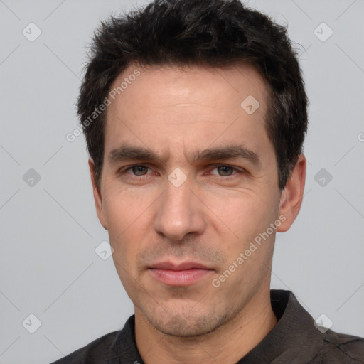 Neutral white adult male with short  brown hair and brown eyes