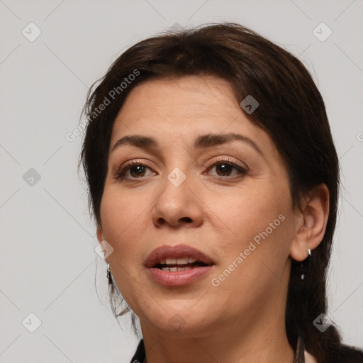 Joyful white adult female with medium  brown hair and brown eyes