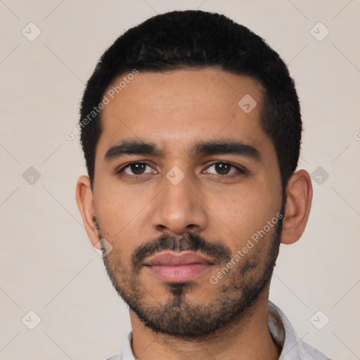 Neutral latino young-adult male with short  black hair and brown eyes