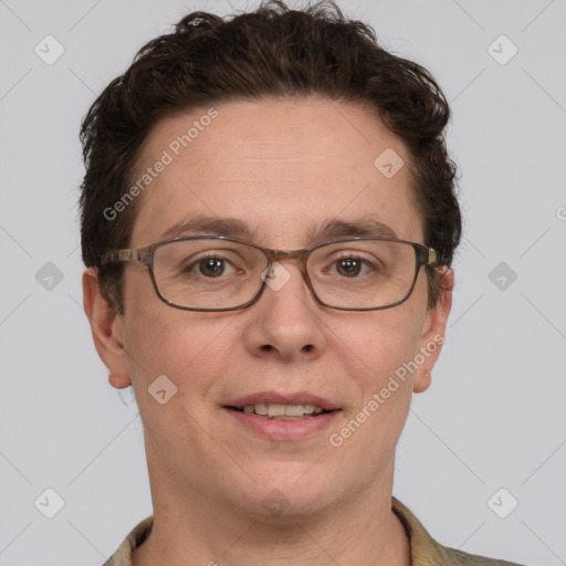 Joyful white adult male with short  brown hair and grey eyes