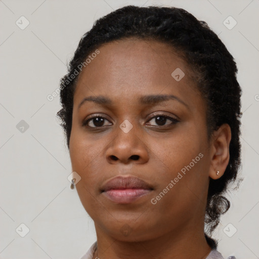 Neutral black young-adult female with short  brown hair and brown eyes