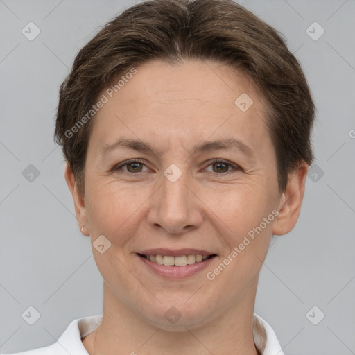 Joyful white adult female with short  brown hair and brown eyes