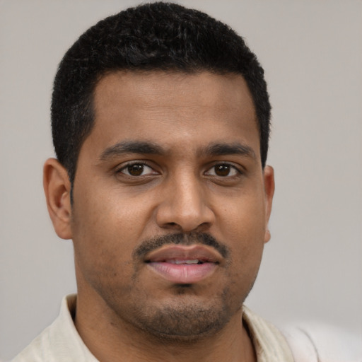Neutral black young-adult male with short  brown hair and brown eyes