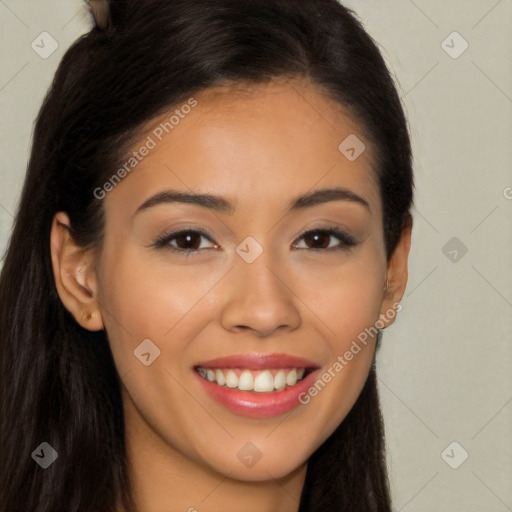 Joyful latino young-adult female with long  brown hair and brown eyes