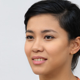 Joyful asian young-adult female with medium  black hair and brown eyes