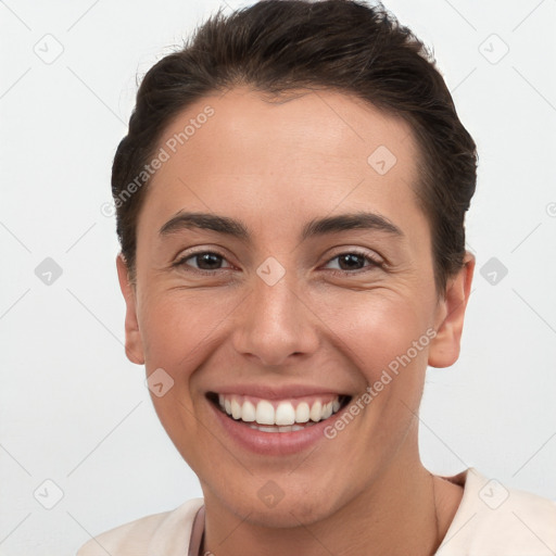 Joyful white young-adult female with short  brown hair and brown eyes