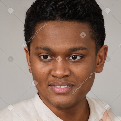 Joyful black young-adult male with short  brown hair and brown eyes
