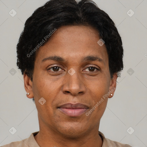 Joyful black adult male with short  brown hair and brown eyes