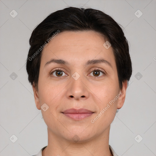 Joyful white adult female with short  brown hair and brown eyes