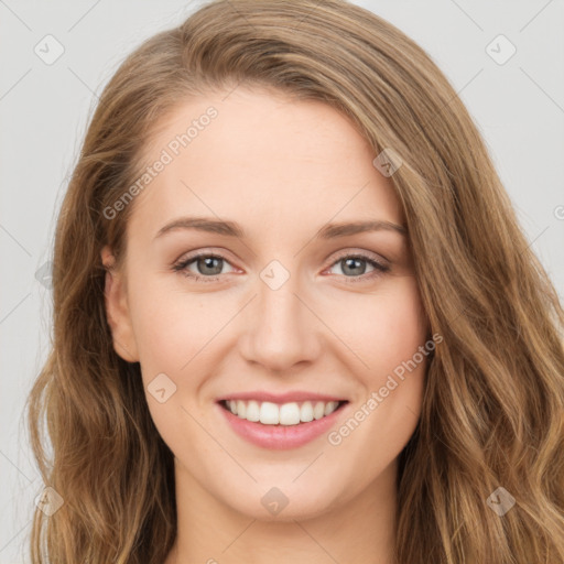 Joyful white young-adult female with long  brown hair and green eyes