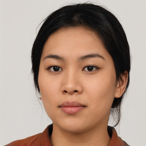 Neutral asian young-adult female with medium  black hair and brown eyes