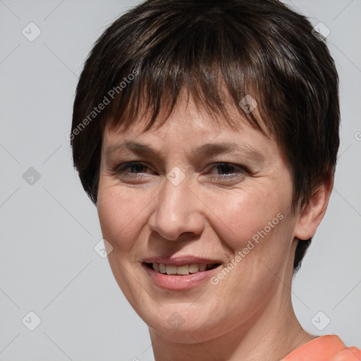 Joyful white adult female with short  brown hair and brown eyes