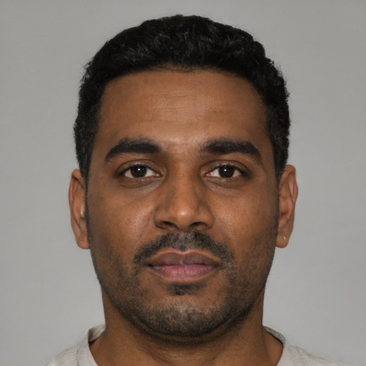 Neutral black young-adult male with short  black hair and brown eyes