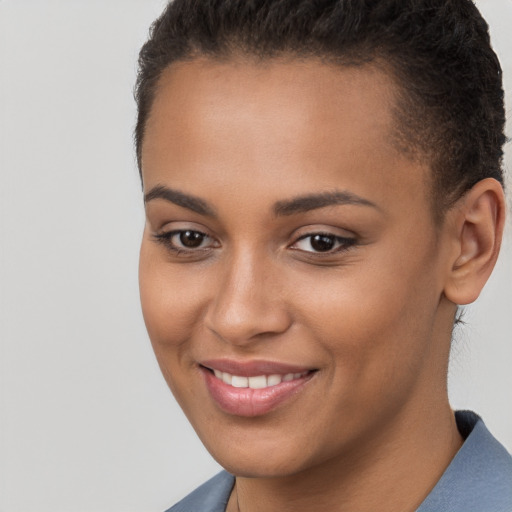 Joyful white young-adult female with short  brown hair and brown eyes