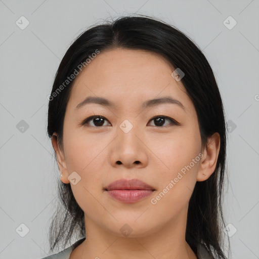 Joyful asian young-adult female with medium  black hair and brown eyes