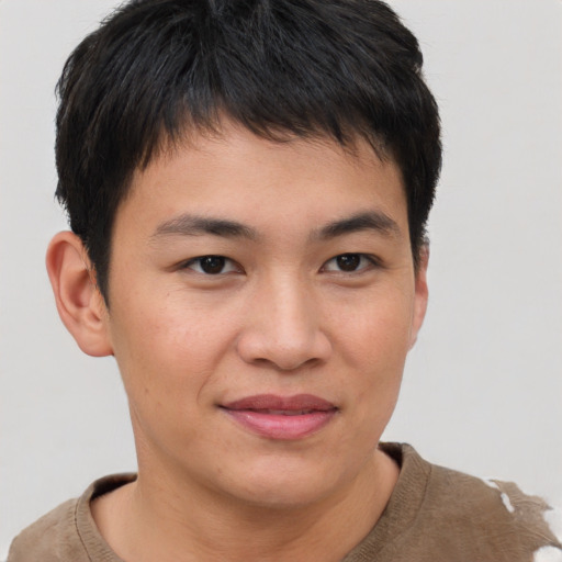 Joyful asian young-adult male with short  brown hair and brown eyes