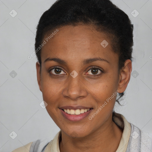 Joyful black young-adult female with short  brown hair and brown eyes