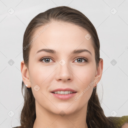 Joyful white young-adult female with long  brown hair and grey eyes