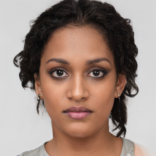 Neutral black young-adult female with medium  brown hair and brown eyes