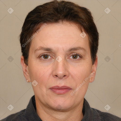 Joyful white adult female with short  brown hair and grey eyes