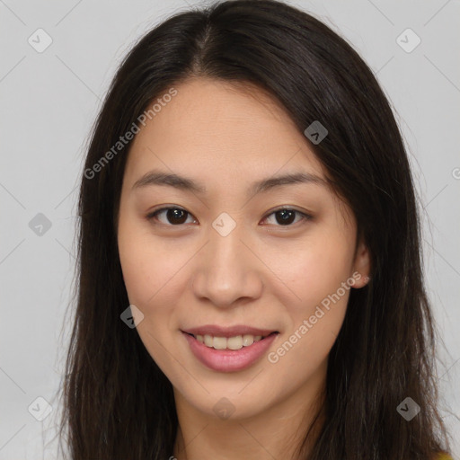 Joyful asian young-adult female with long  brown hair and brown eyes