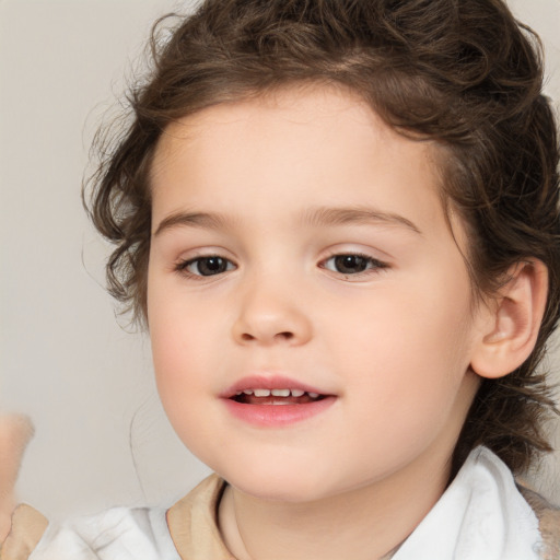 Joyful white child female with medium  brown hair and brown eyes