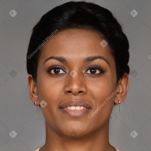 Joyful black young-adult female with short  black hair and brown eyes