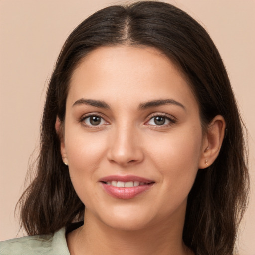 Joyful white young-adult female with medium  brown hair and brown eyes