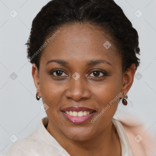 Joyful black young-adult female with short  brown hair and brown eyes