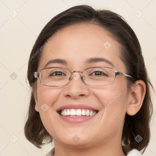 Joyful white young-adult female with medium  brown hair and green eyes