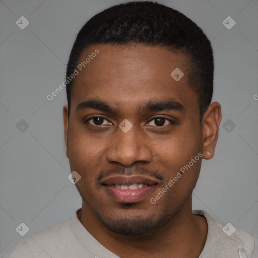 Joyful black young-adult male with short  brown hair and brown eyes