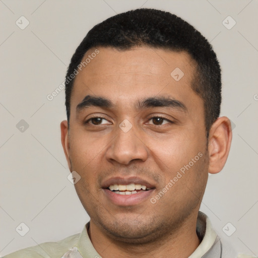 Joyful latino young-adult male with short  black hair and brown eyes