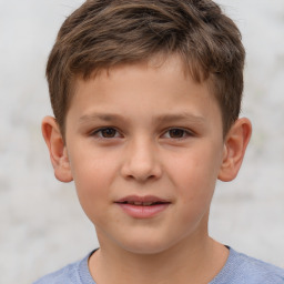 Joyful white child male with short  brown hair and brown eyes