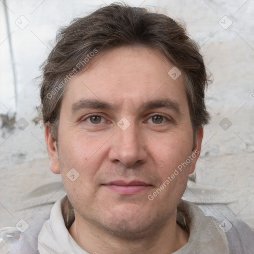 Joyful white adult male with short  brown hair and grey eyes