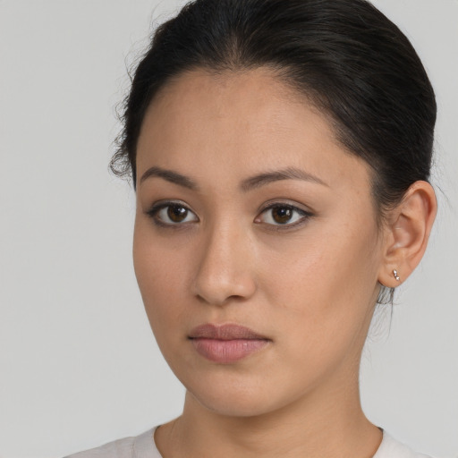 Neutral latino young-adult female with short  brown hair and brown eyes