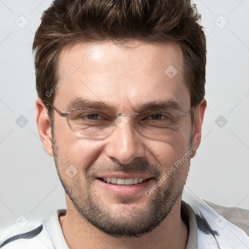 Joyful white adult male with short  brown hair and brown eyes