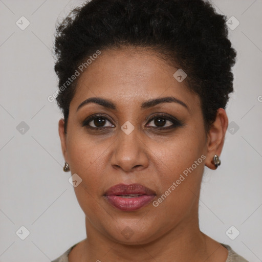 Joyful black young-adult female with short  brown hair and brown eyes