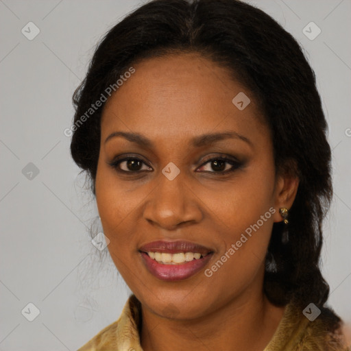 Joyful black adult female with long  brown hair and brown eyes