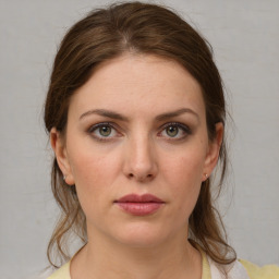 Neutral white young-adult female with medium  brown hair and grey eyes