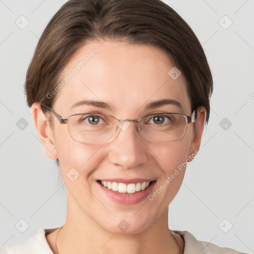 Joyful white young-adult female with short  brown hair and grey eyes