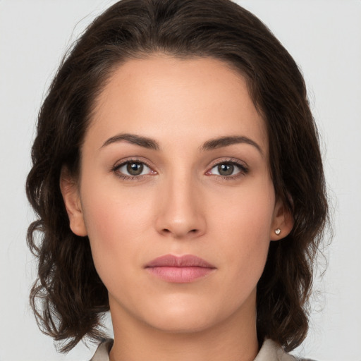 Neutral white young-adult female with medium  brown hair and brown eyes