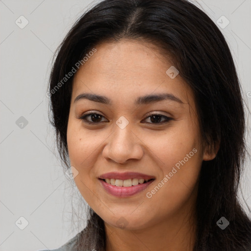 Joyful white young-adult female with long  brown hair and brown eyes