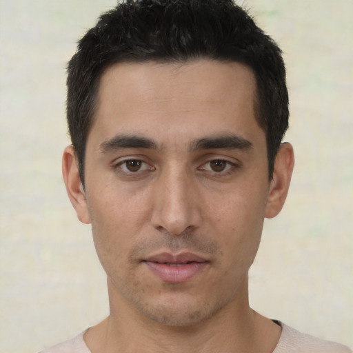 Neutral white young-adult male with short  black hair and brown eyes