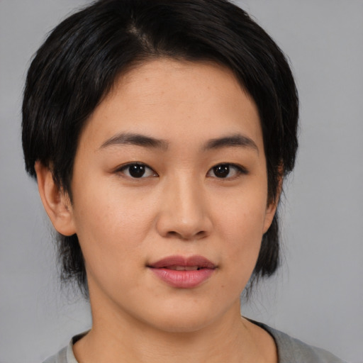 Neutral asian young-adult female with medium  black hair and brown eyes