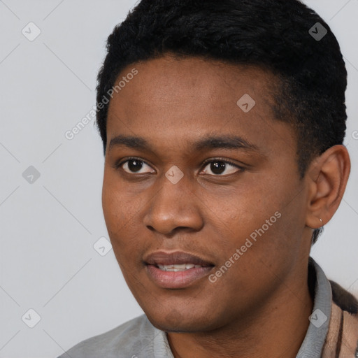 Joyful black young-adult male with short  black hair and brown eyes