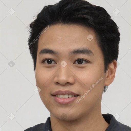 Joyful asian young-adult male with short  black hair and brown eyes