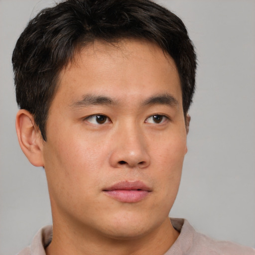 Neutral asian young-adult male with short  brown hair and brown eyes