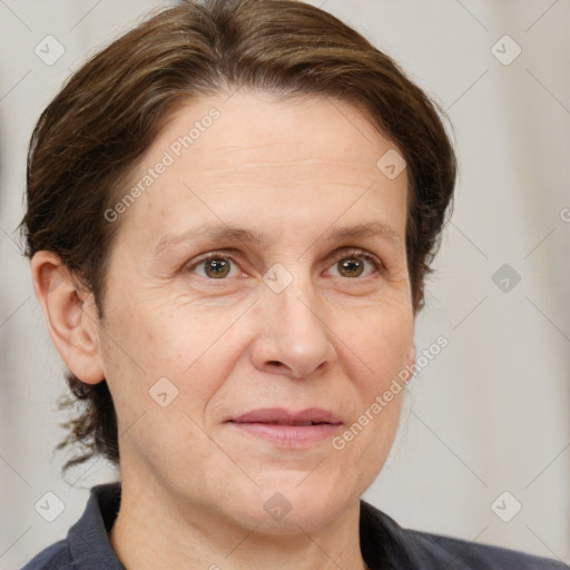 Joyful white adult female with medium  brown hair and brown eyes