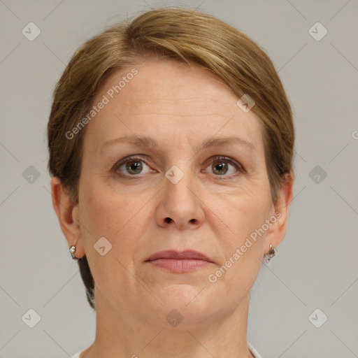 Joyful white adult female with short  brown hair and grey eyes